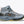 Gray and light blue Hoka hiking boot with a Vibram outsole on a white background