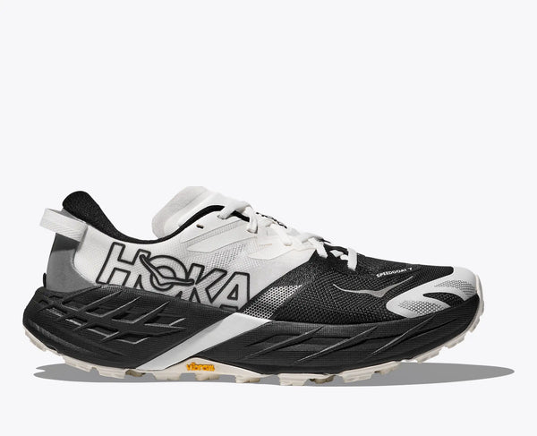 Black and white running shoe with Hoka branding on a white background