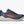 Gray running shoe with orange 'Hoka' logo on a white background