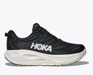 Black running shoe with white sole on a light gray background