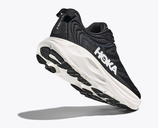 Black running shoe with white sole on a white background