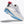 White running shoe with blue sole and red tag on a white background
