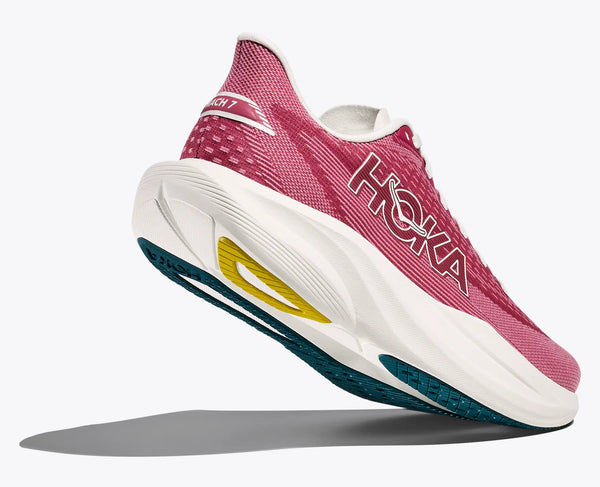 Pink running shoe with white sole on a light gray background