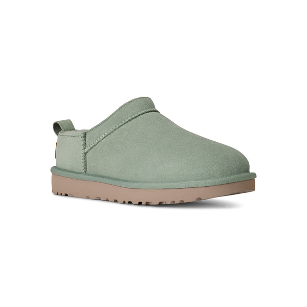 Light green ugg slipper on a white background