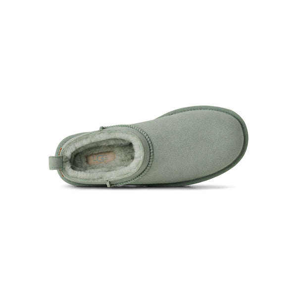Light green ugg slipper on a white background