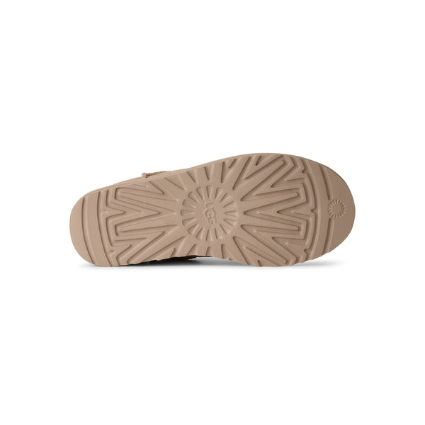 Beige ankle length slipper on a white background