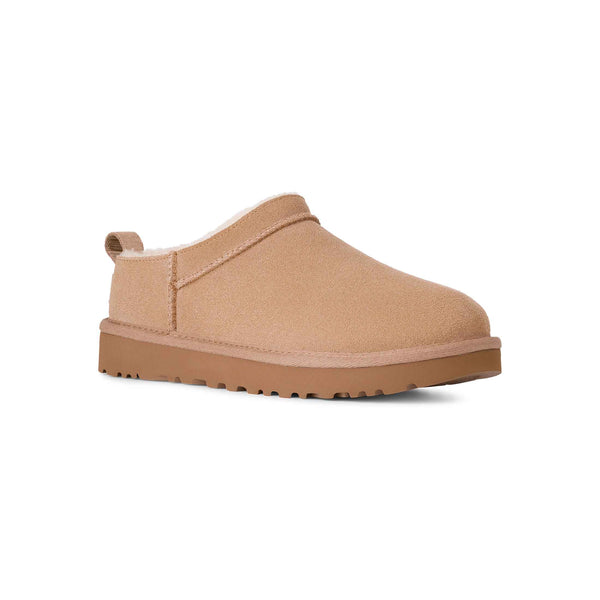 Tan slip-on shoe on a white background