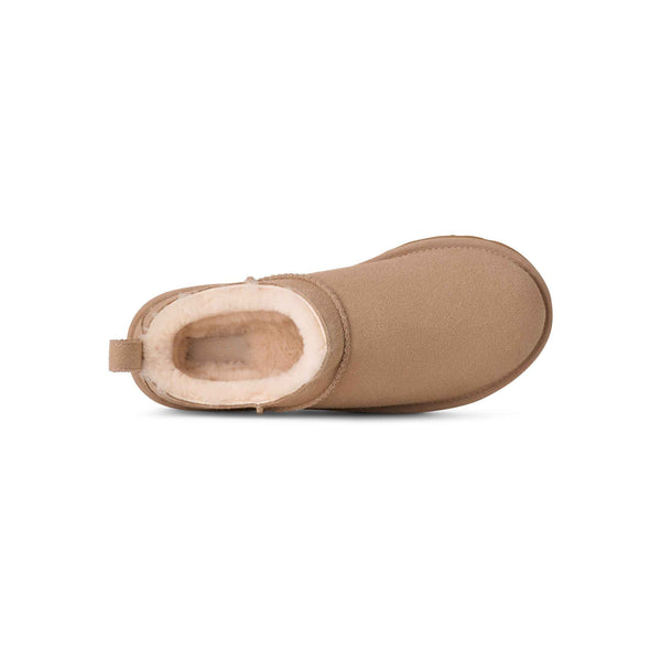 Tan boot with white fur lining on a white background