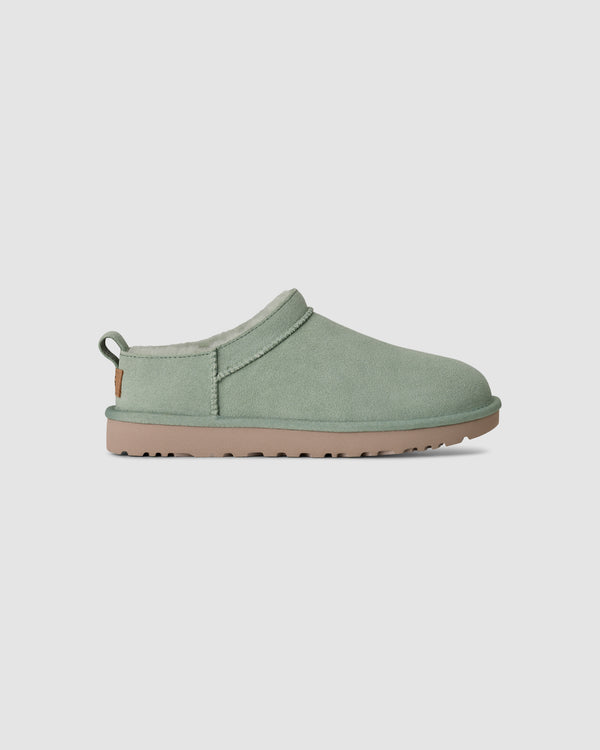 Light green ugg slipper on a white background
