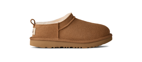 Kids ankle length tan slipper boot on a white background