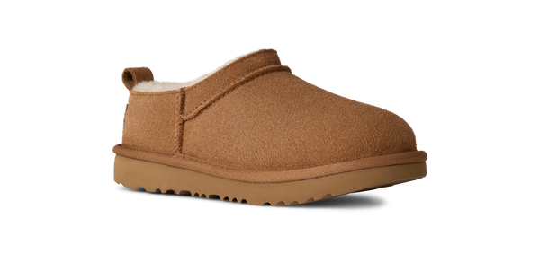 Kids ankle length tan slipper boot on a white background