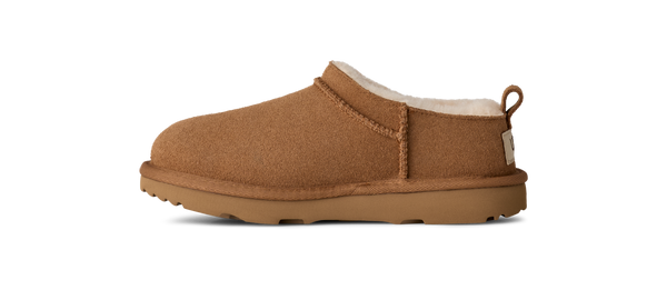 Kids ankle length tan slipper boot on a white background