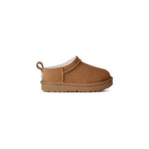 Toddler tan slipper on a white background