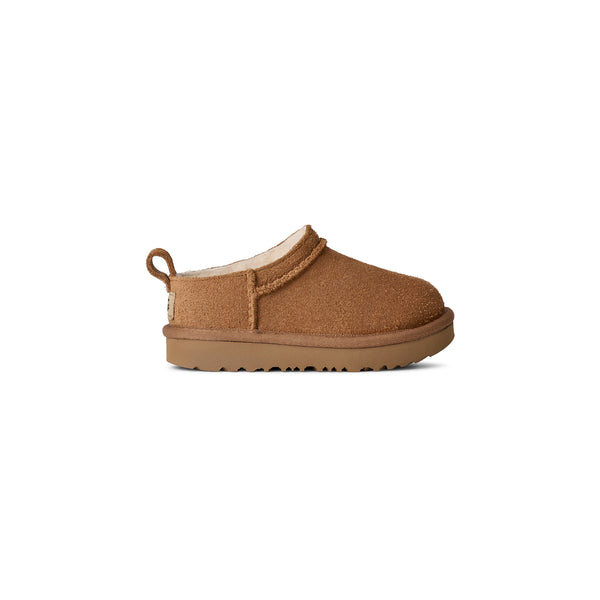Toddler tan slipper on a white background