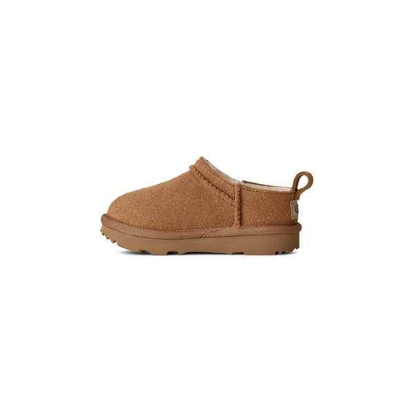 Toddler tan slipper on a white background