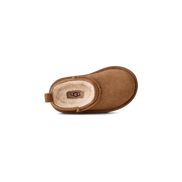 Toddler tan slipper on a white background