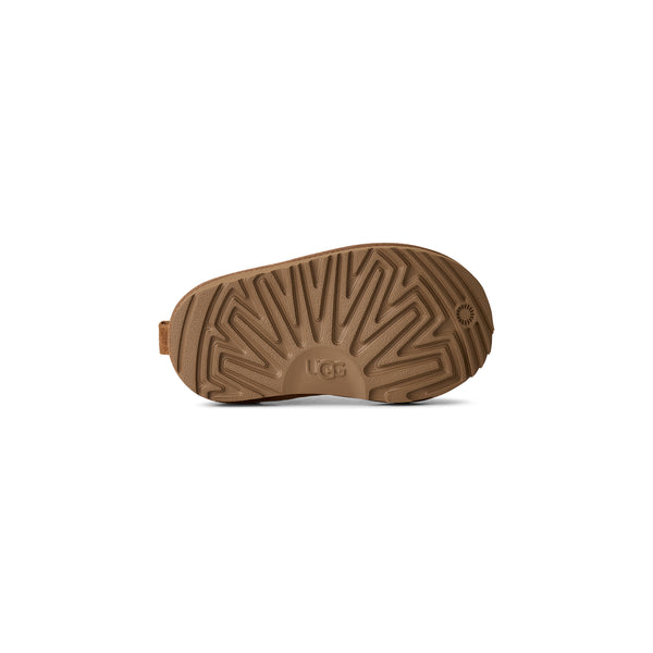 Toddler tan slipper on a white background