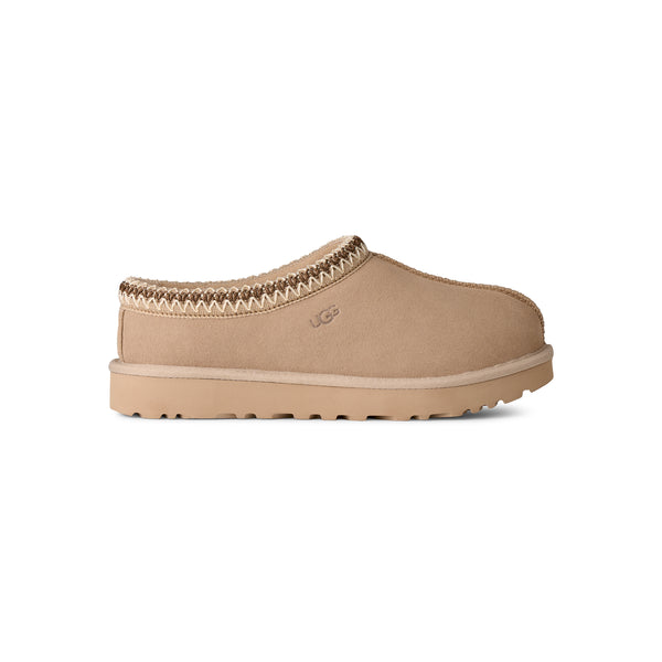 Light tan ugg slipper on a white background