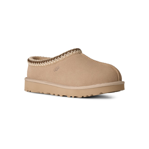 Light tan ugg slipper on a white background