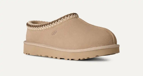 Light tan ugg slipper on a white background