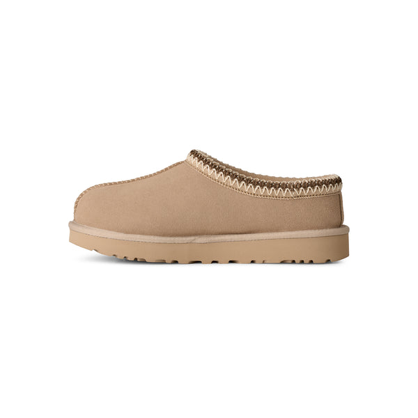 Light tan ugg slipper on a white background