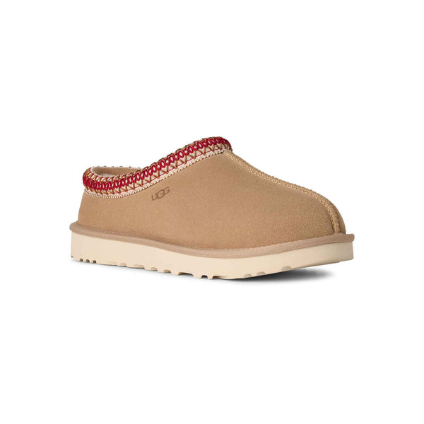 Tan slipper with red interior on a white background