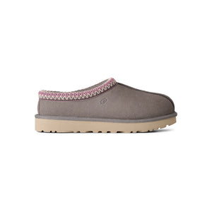 Grey, pink, and tan slipper on a white background