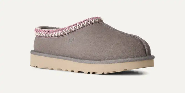 Grey, pink, and tan slipper on a white background