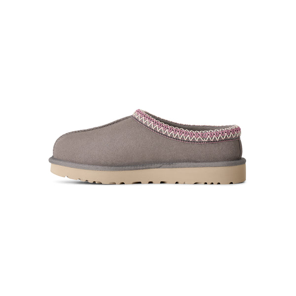 Grey, pink, and tan slipper on a white background