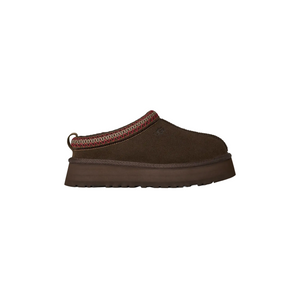 Brown slip-on shoe with a platform sole on a white background