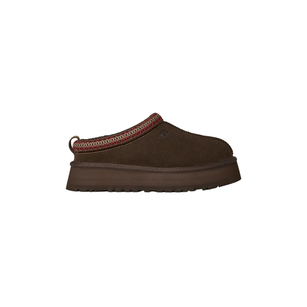 Brown slip-on shoe with a platform sole on a white background