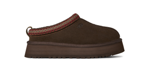 Brown slip-on shoe with a platform sole on a white background