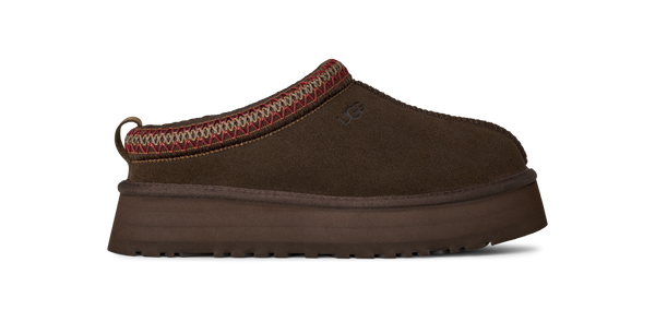 Brown slip-on shoe with a platform sole on a white background
