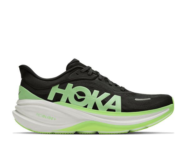 Running shoe with white and green midsole and black upper