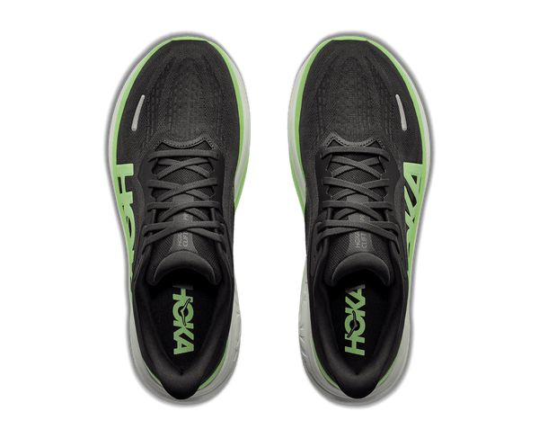 Running shoe with white and green midsole and black upper