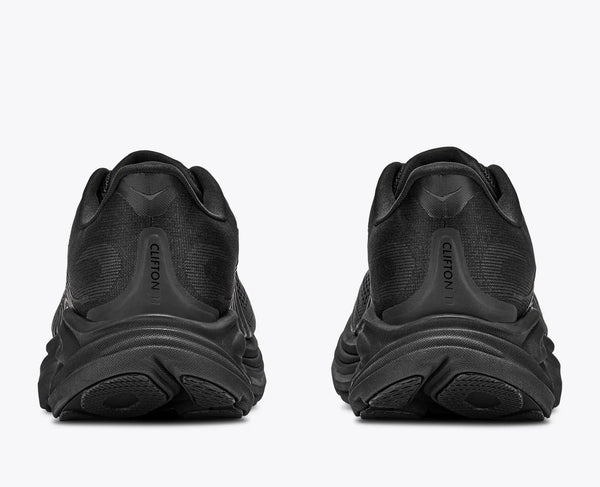 Black athletic shoes shown from the back on a white background