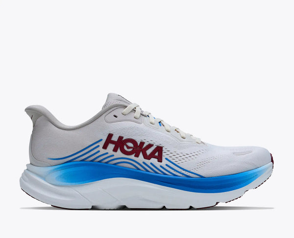 White running shoe with blue sole and Hoka branding on a white background