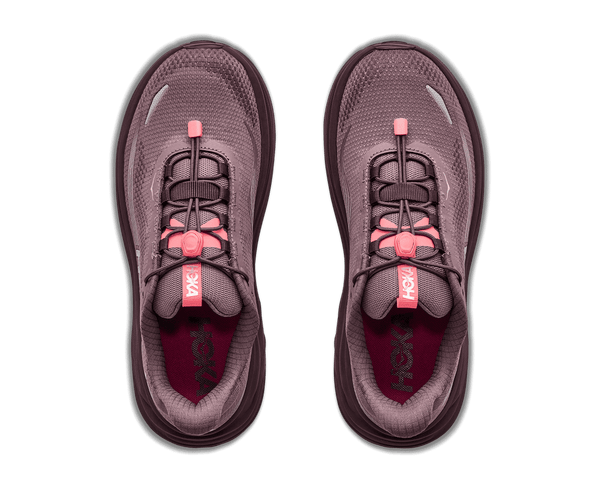 A HOKA running shoe in a muted plum-purple color with bright pink laces and pull tabs