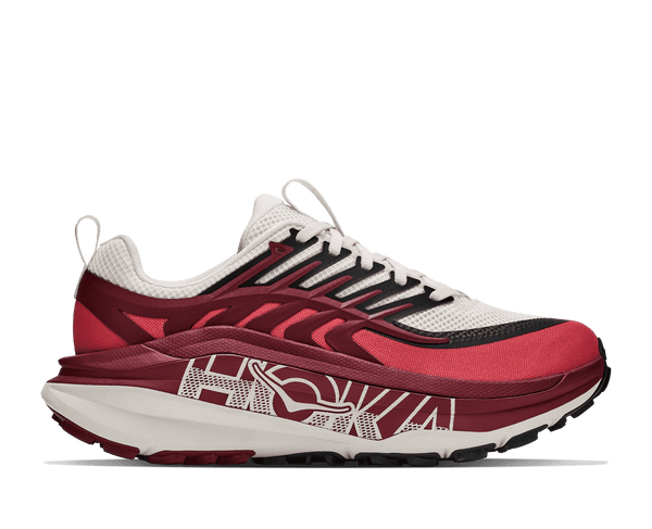 Burgundy and white trail running shoe on a white background