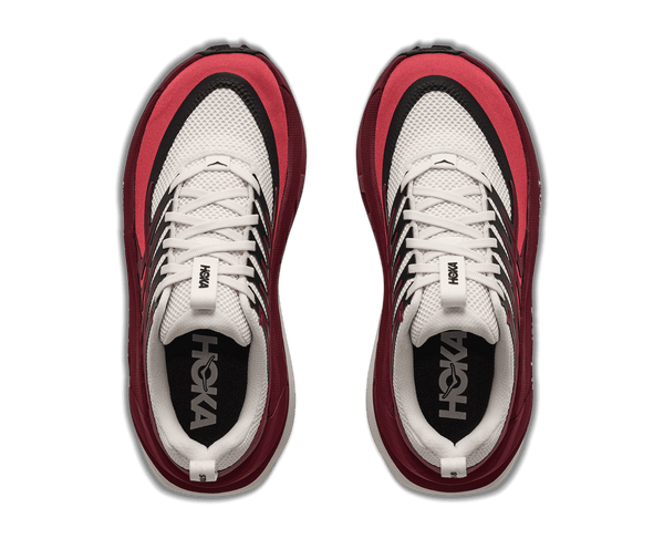 Burgundy and white trail running shoe on a white background