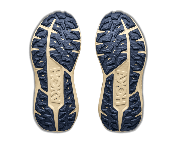 Tan trail running shoe on a white background