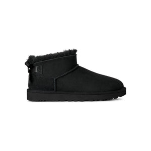 Black ankle length slipper boot with bow on the back  