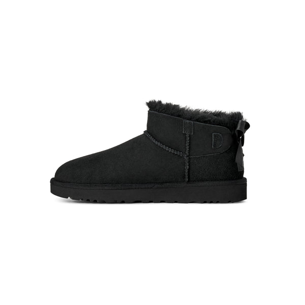 Black ankle length slipper boot with bow on the back  