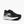 A women's Brooks shoe at a diagonal angle with a black upper and a white midsole.