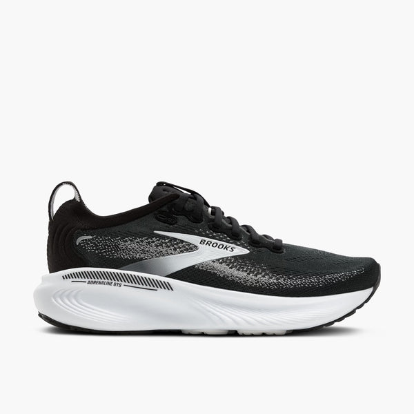 Black women's Adrenaline 25 Brooks running shoe with white sole on a light gray background