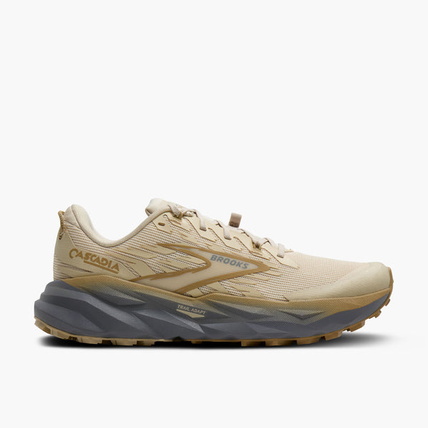 Beige running shoe with 'Brooks' branding on a white background