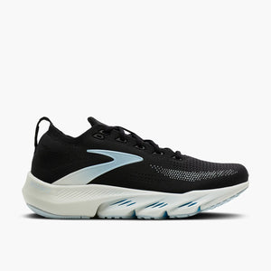 Black running shoe with white sole on a light gray background