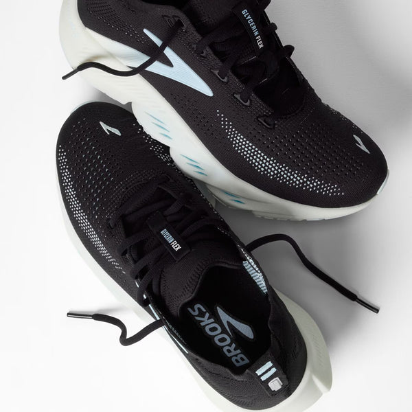 A pair of black Brooks running shoes with white and light blue accents, displayed on a clean white background.
