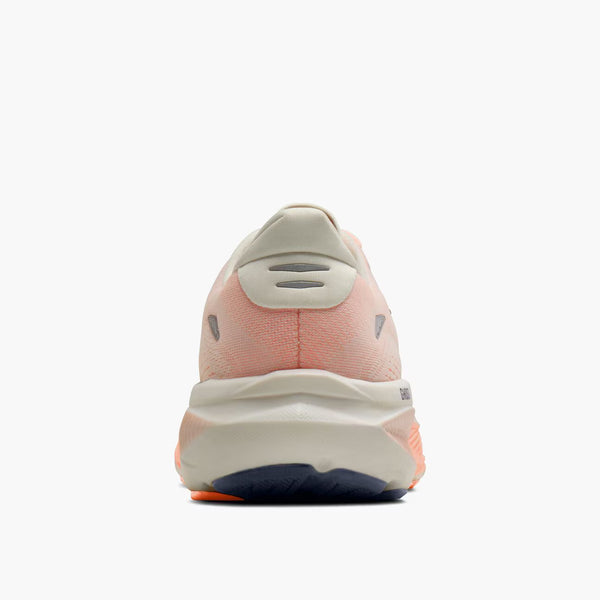Light melon colored women's running shoe with 'Brooks' branding on a white background