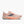 Light melon colored women's running shoe with 'Brooks' branding on a white background